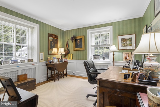 office area with wallpapered walls, wood finished floors, a healthy amount of sunlight, and a wainscoted wall