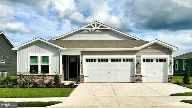 craftsman house featuring a front yard and a garage