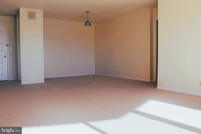 unfurnished room with carpet flooring