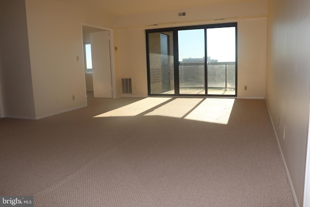 empty room with light colored carpet