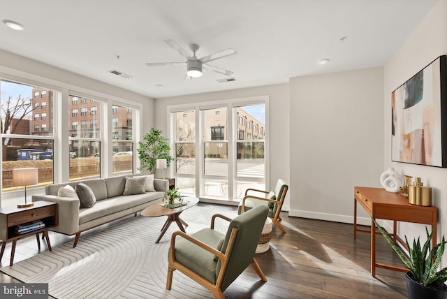 interior space featuring ceiling fan and a healthy amount of sunlight