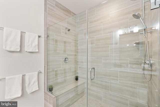 bathroom with a shower with shower door