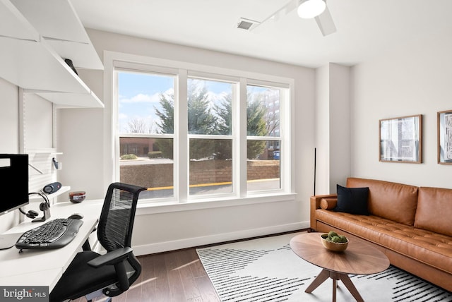 office space with ceiling fan and dark wood-type flooring