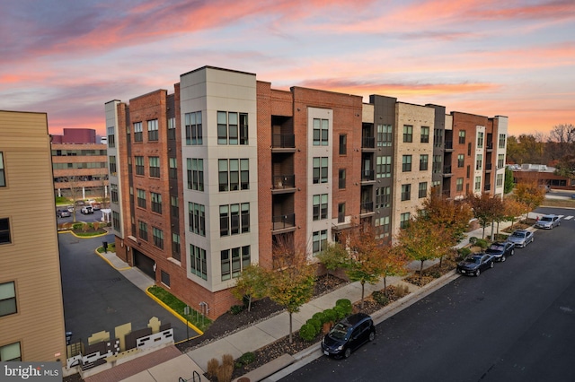 view of outdoor building at dusk