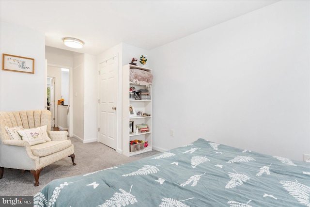 bedroom featuring light colored carpet