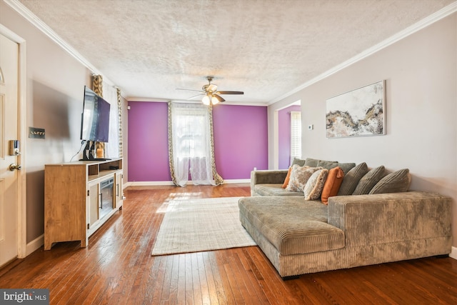 living room featuring ornamental molding, a textured ceiling, hardwood / wood-style flooring, and ceiling fan