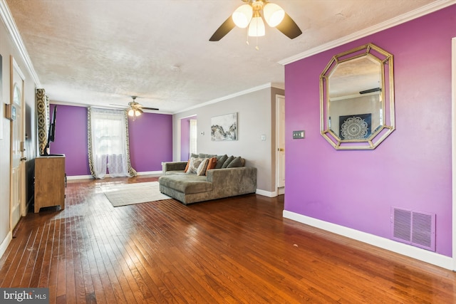 unfurnished living room with ornamental molding, hardwood / wood-style floors, a textured ceiling, and ceiling fan