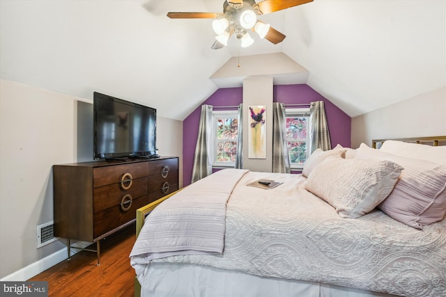 bedroom with lofted ceiling, dark hardwood / wood-style floors, and ceiling fan