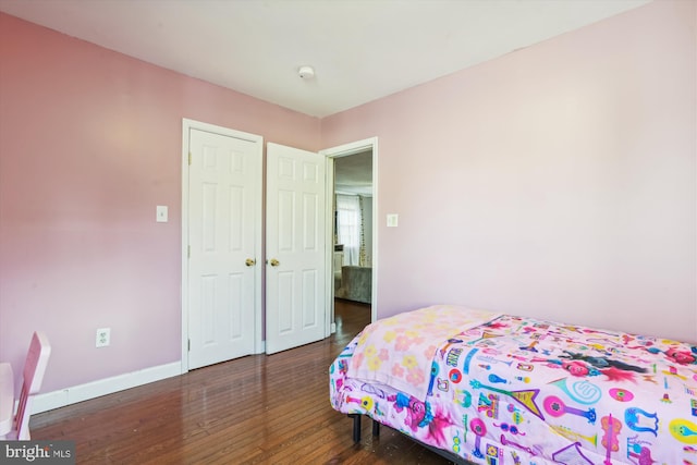 bedroom featuring dark wood-type flooring