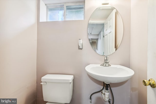 bathroom with toilet and sink