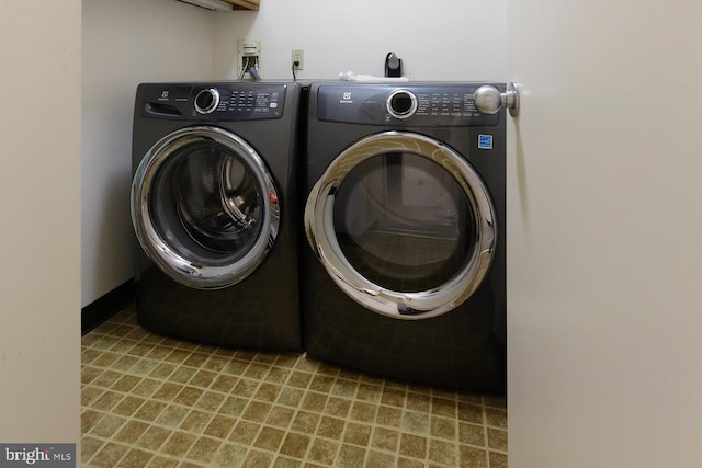 laundry room featuring separate washer and dryer