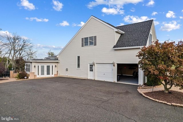 view of side of property featuring a garage