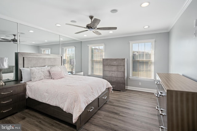 bedroom featuring crown molding, dark hardwood / wood-style flooring, multiple windows, and ceiling fan