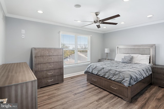 bedroom featuring crown molding, hardwood / wood-style flooring, and ceiling fan