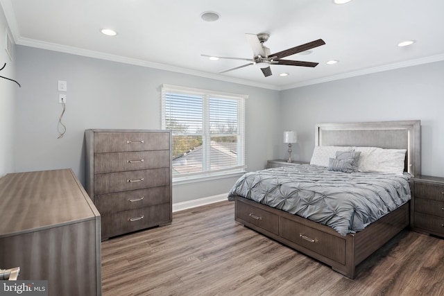 bedroom featuring ornamental molding, hardwood / wood-style flooring, and ceiling fan