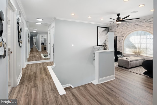 hall with crown molding and hardwood / wood-style floors