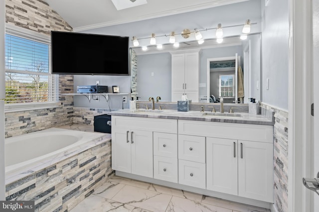 bathroom featuring a relaxing tiled tub, vanity, lofted ceiling, and crown molding