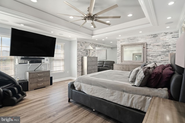 bedroom featuring crown molding, multiple windows, light wood-type flooring, and ceiling fan