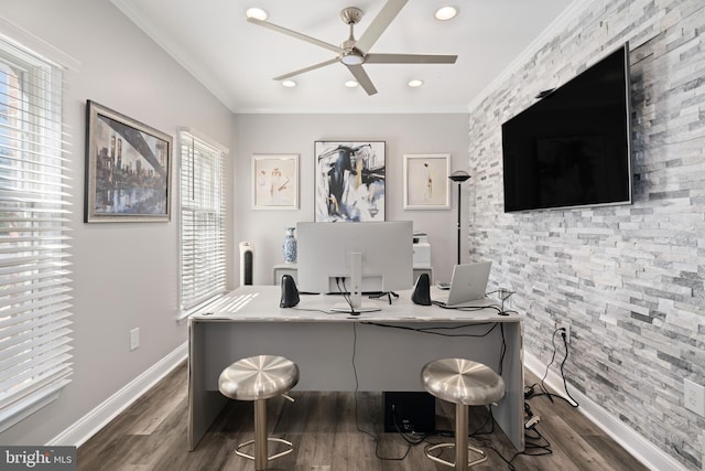 office with dark wood-type flooring, ornamental molding, and a healthy amount of sunlight