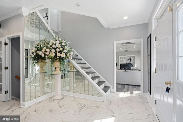 entryway featuring crown molding