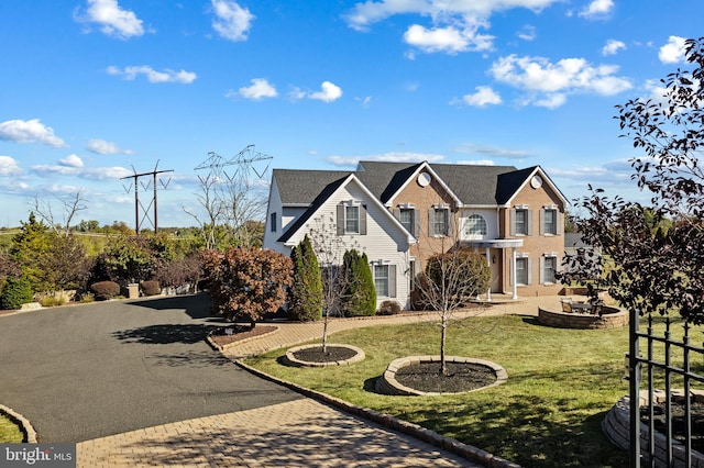 view of front of home featuring a front lawn