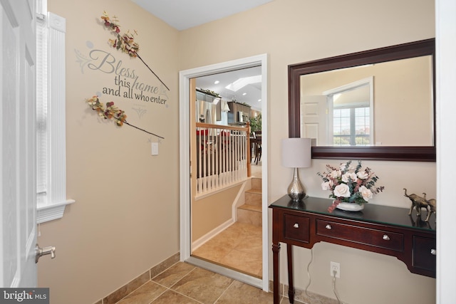 doorway featuring light tile patterned floors