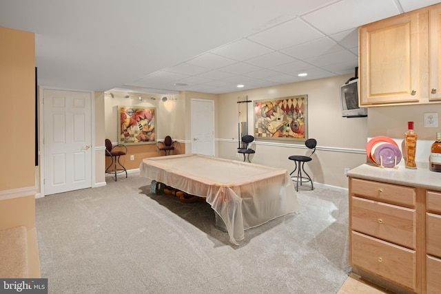 rec room with light colored carpet, a drop ceiling, and pool table