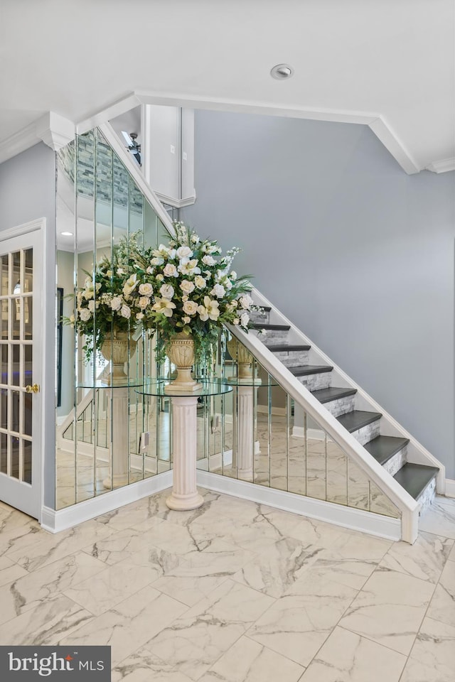 staircase with crown molding