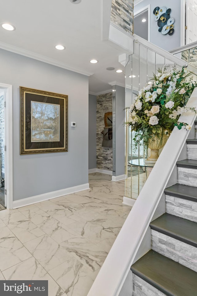 stairway featuring crown molding and plenty of natural light