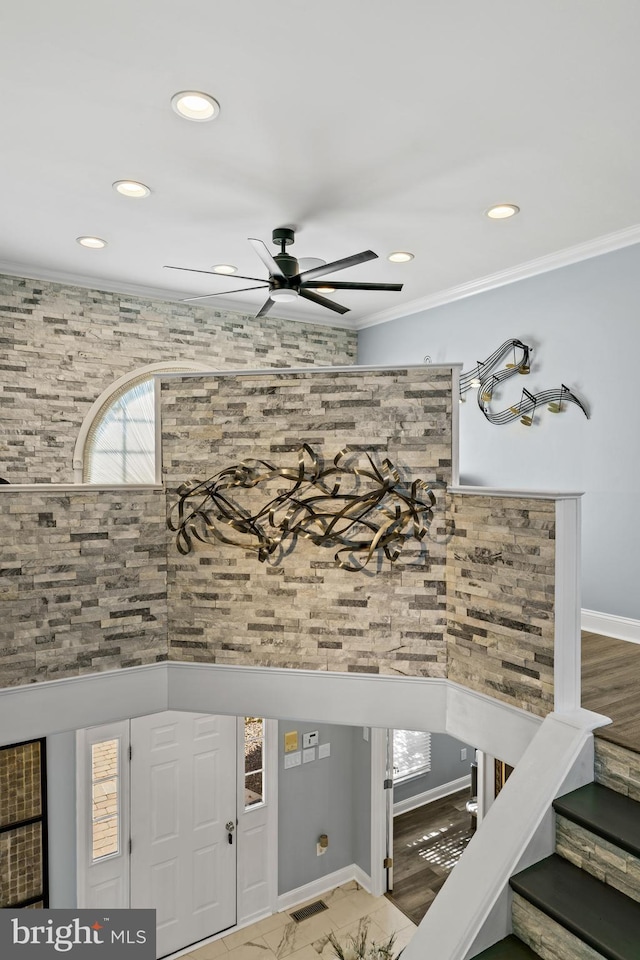 interior space with crown molding, ceiling fan, and hardwood / wood-style floors