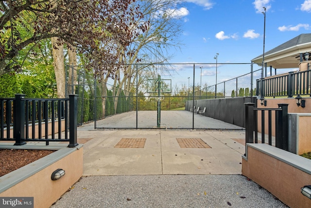 view of gate featuring a patio area