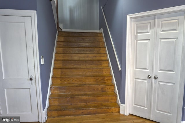 staircase featuring hardwood / wood-style floors