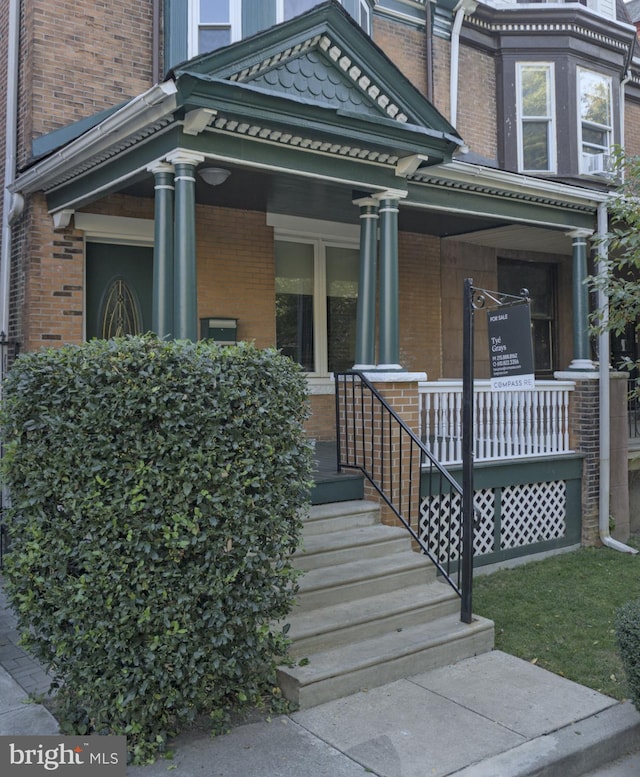 entrance to property with covered porch