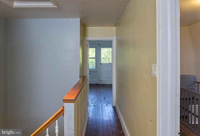 hallway featuring dark hardwood / wood-style flooring