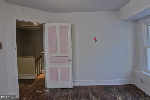 unfurnished room featuring dark hardwood / wood-style floors