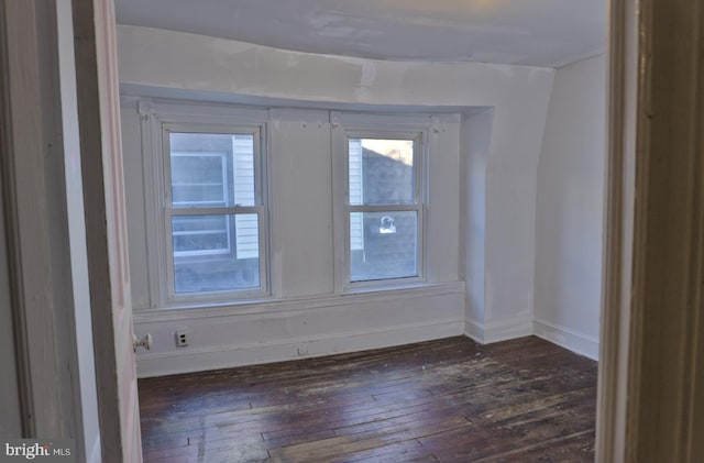 spare room featuring dark hardwood / wood-style flooring