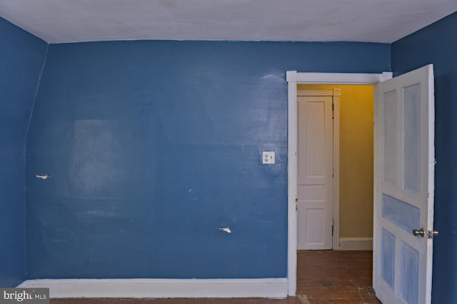 empty room with hardwood / wood-style floors