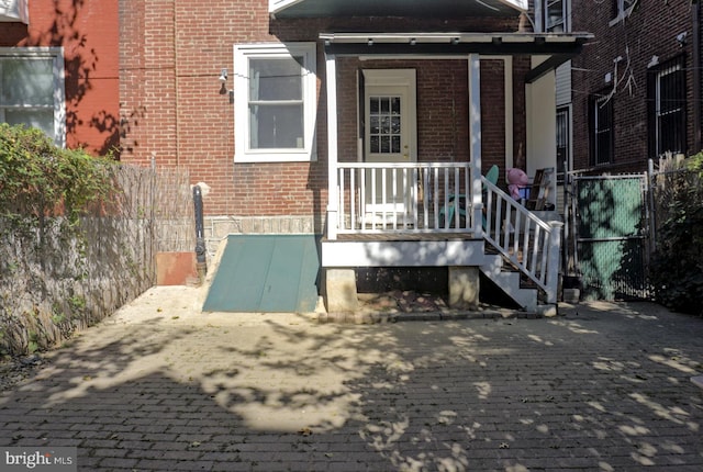 doorway to property featuring a porch