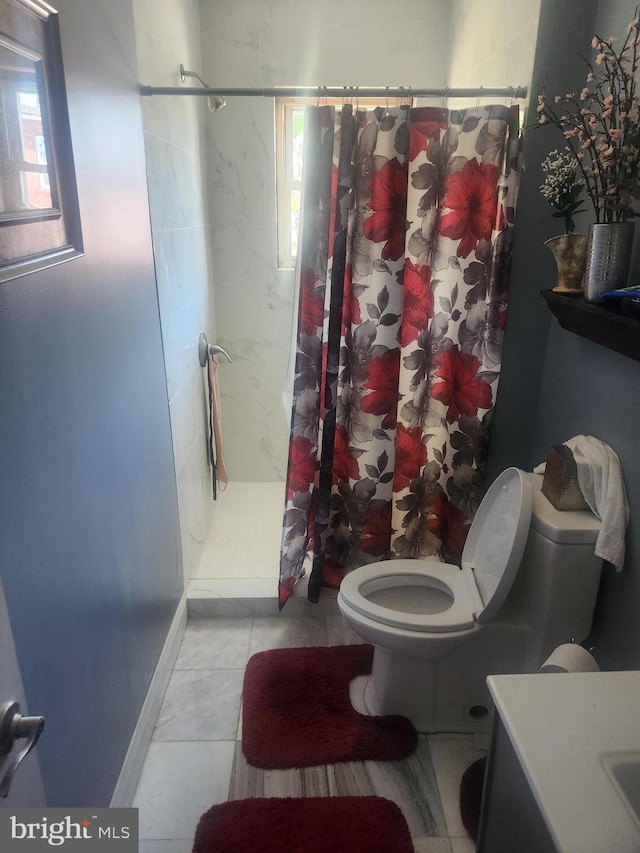 bathroom with walk in shower, vanity, toilet, and tile patterned floors