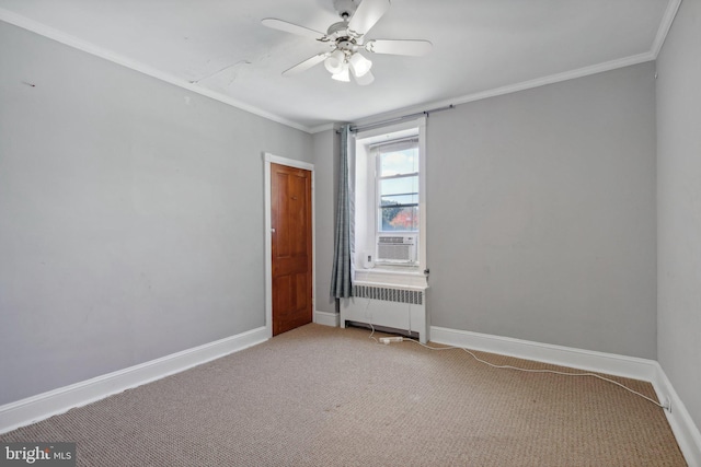 spare room featuring crown molding, radiator heating unit, carpet flooring, and ceiling fan