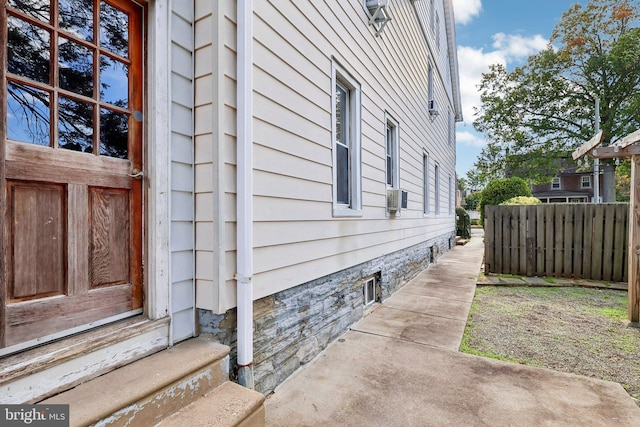 view of side of property featuring cooling unit