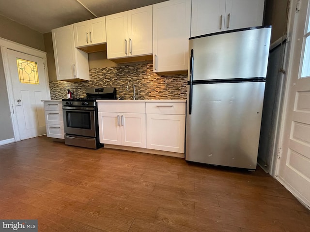 kitchen with white cabinetry, stainless steel appliances, and light wood-type flooring