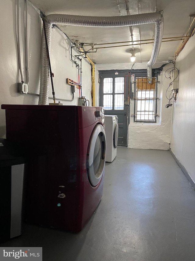 laundry area featuring washing machine and clothes dryer