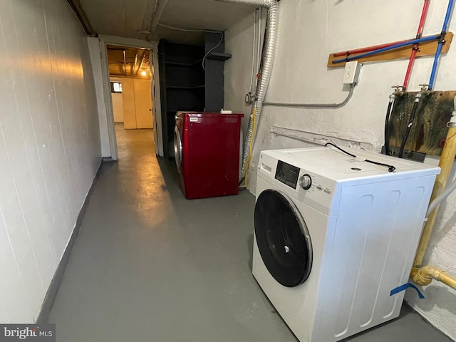 clothes washing area featuring washer / clothes dryer