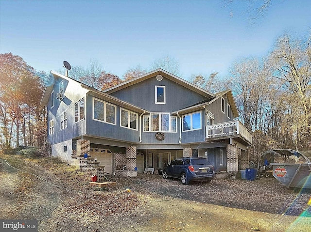 back of property with a garage