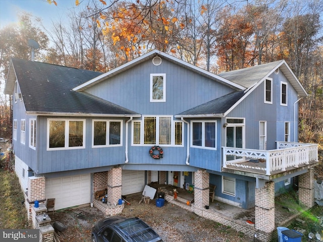 42 Mulberry Dr, Delta, PA 17314 - back of house with roof with shingles, a garage, and a deck