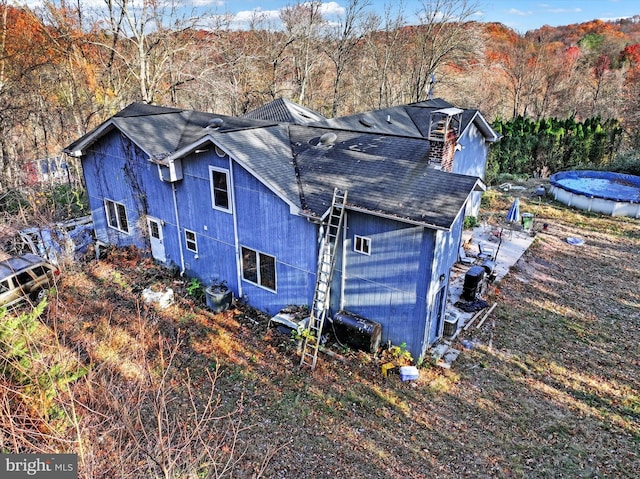 42 Mulberry Dr, Delta, PA 17314 - view of side of property with roof with shingles and a view of trees