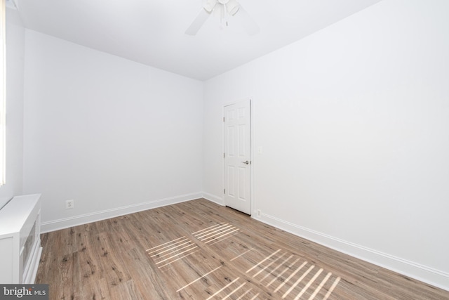 unfurnished room featuring ceiling fan and wood-type flooring