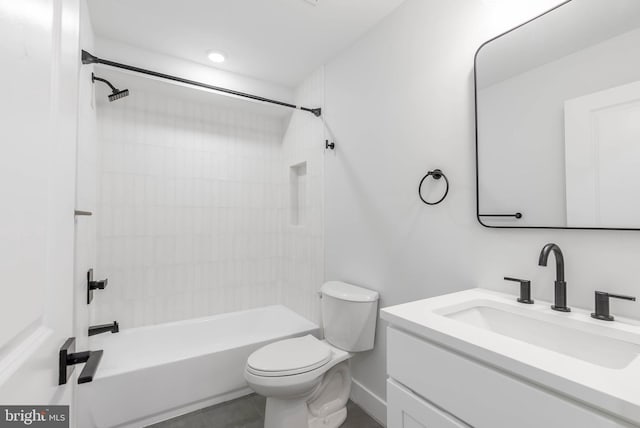 full bathroom featuring vanity, toilet, and tiled shower / bath