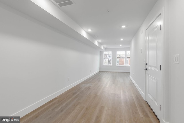 hallway with light wood-type flooring